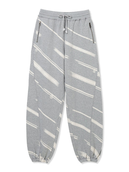 PRINT TERRY DIAGONAL ZIP JOGGER PANTS